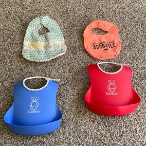 Assorted bibs, baby Bjorn bibs that catch excess food. Smoke and pet free home.